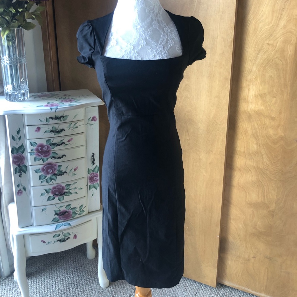 Beautiful Black Dress,  midi length with slit in back.